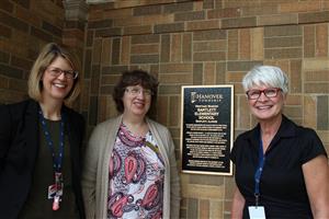 U-46 staff next to heritage marker at Bartlett elementary 