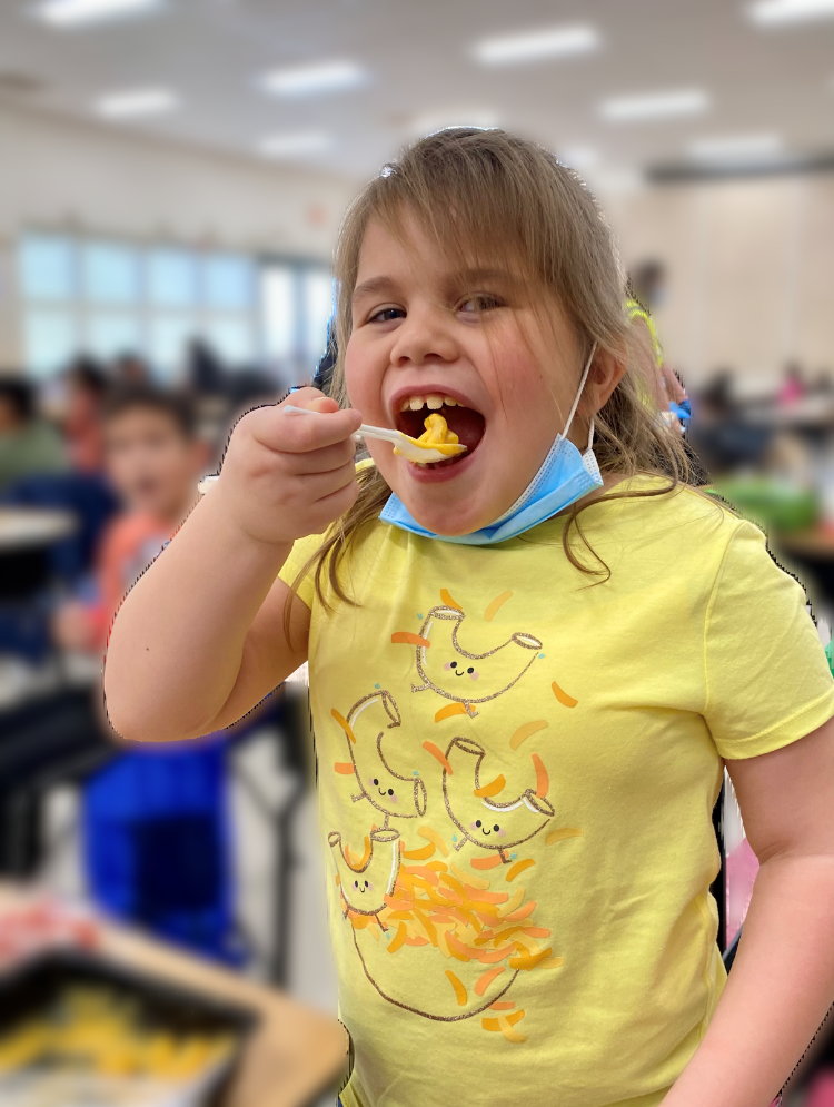 student eating mac and cheese