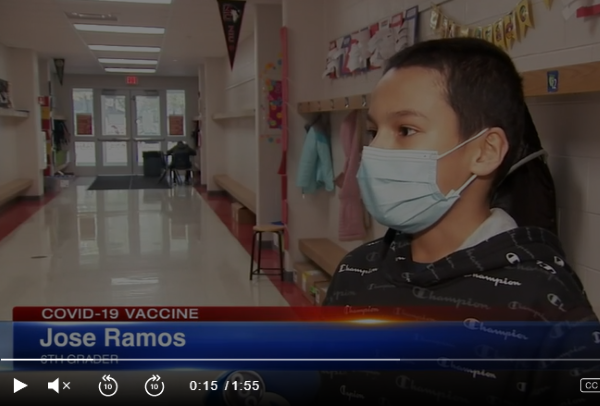  A Coleman Student talks to a TV crew in the hallway of his school 