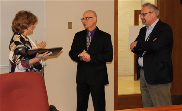 Melanie Meidel receives an award from the Department of Defense 