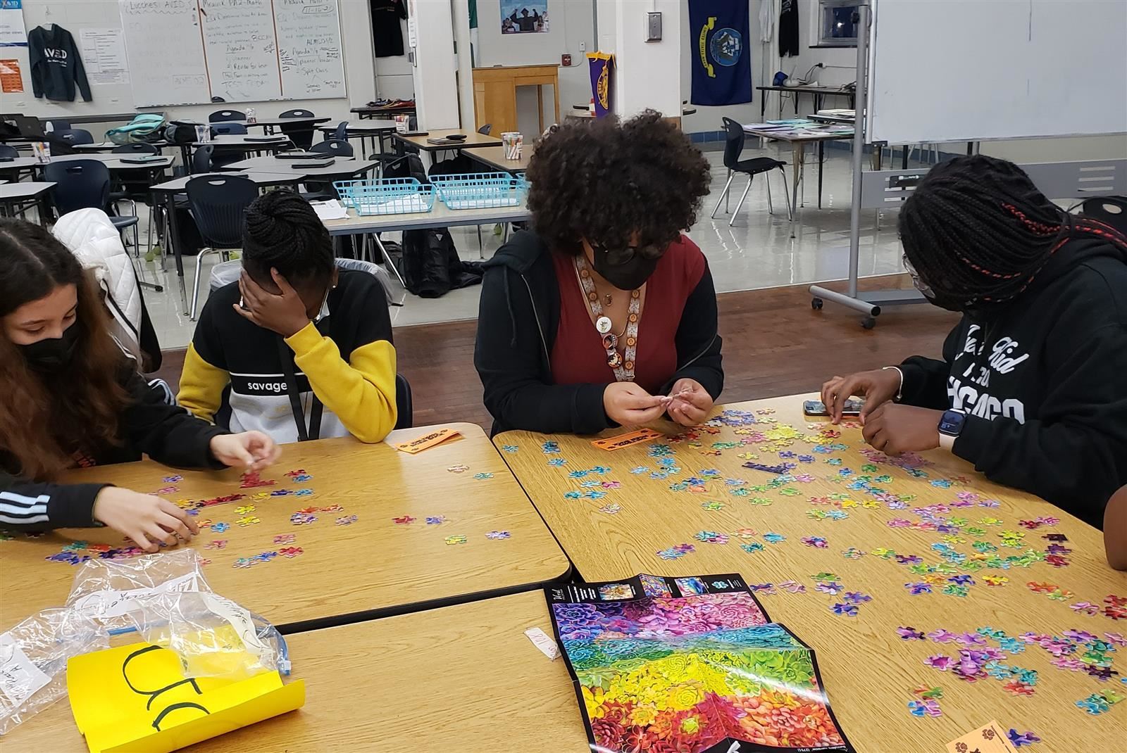  Girls in the LEAD program work together on a puzzle 