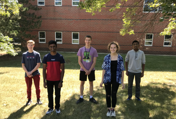  Five Bartlett High School students stand outside their school 