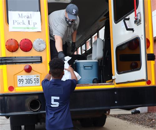 U-46 Student Gets Meal from a Bus 