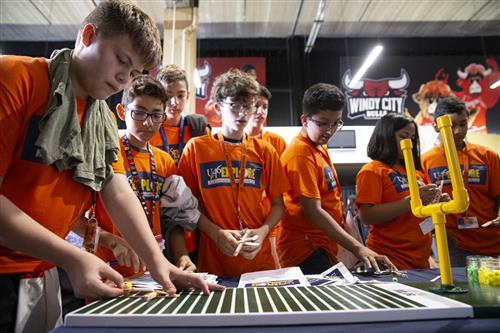 U-46 students make a catapult out of plastic spoons 