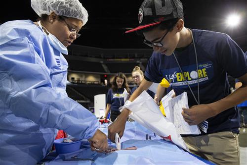 A U-46 middle school student checks out a medical exhibit at Explore 