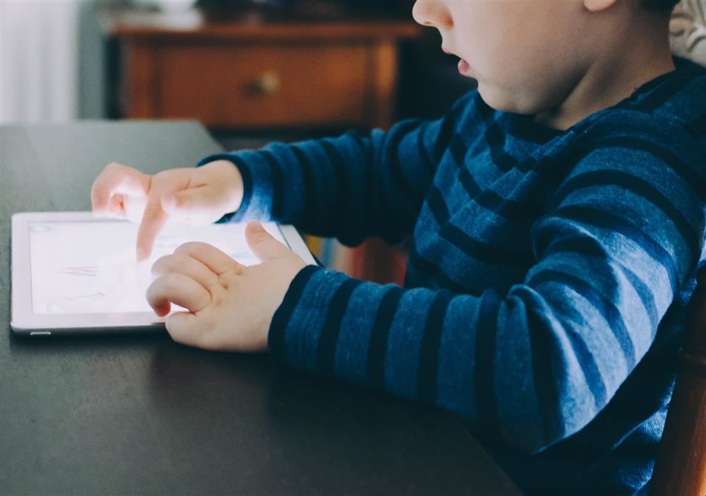  Child working on iPad